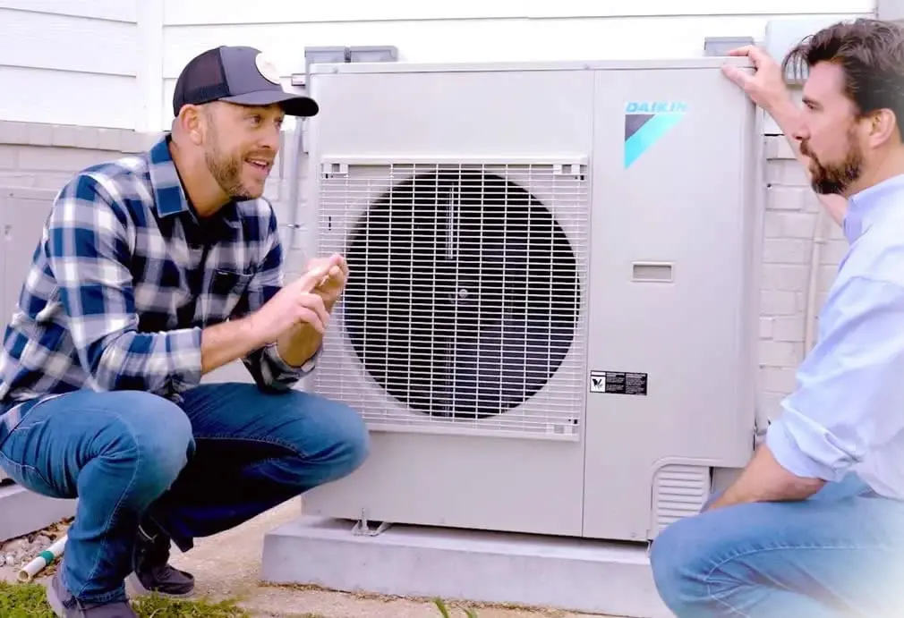 Dave Marrs with Daikin representative talking about how good the Daikin heat pumps are.
